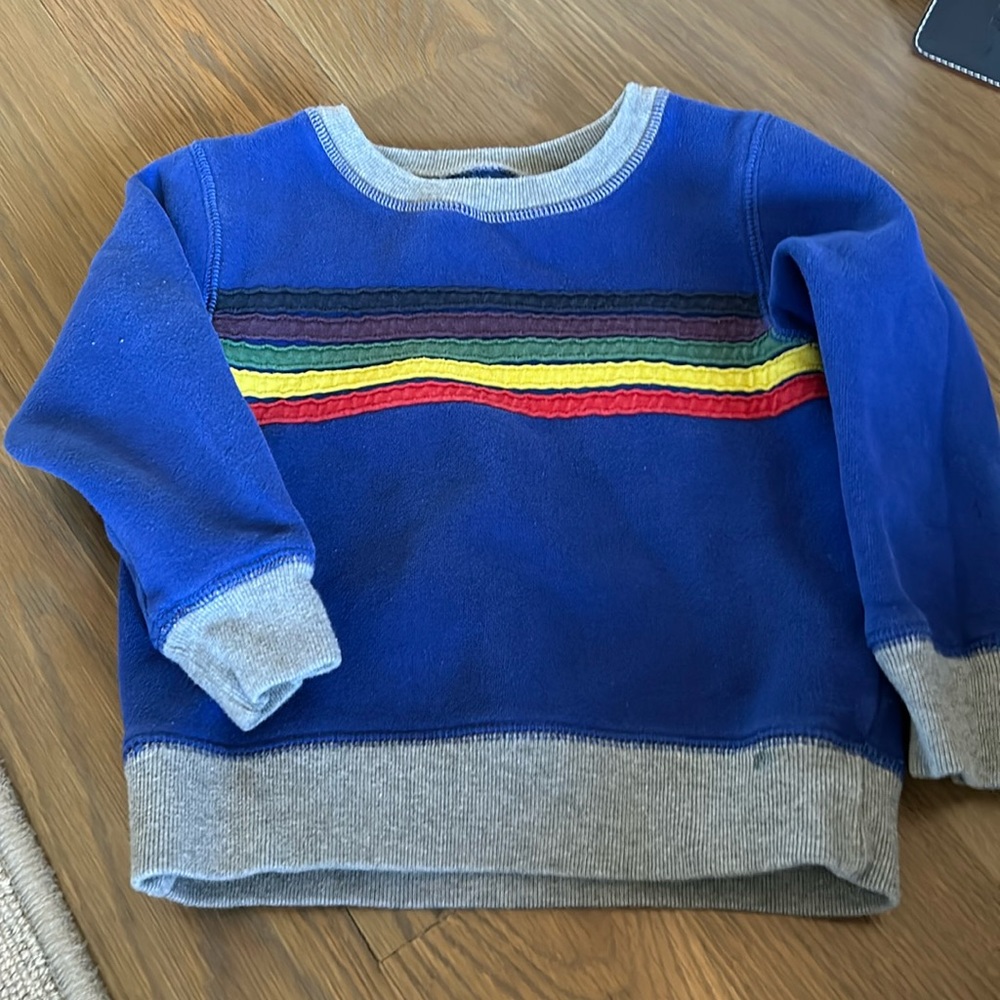 Bright blue, mini Boden sweatshirt with rainbow color stripes